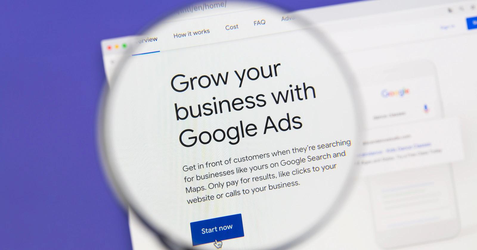 Magnifying glass over webpage text - Grow your business with Google Ads