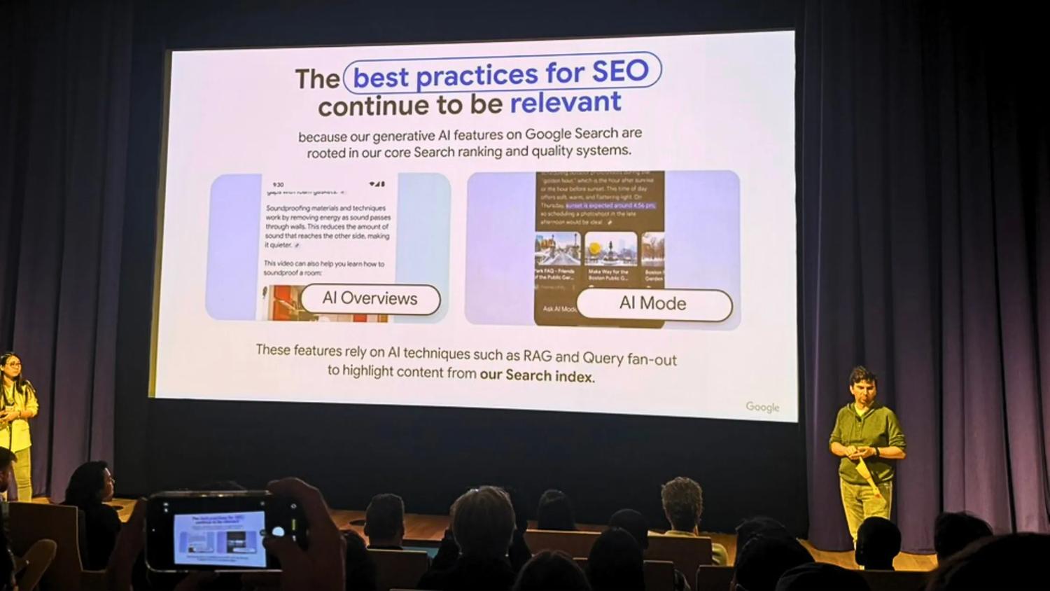 Photo of stage, speaker and screen at Google's Search Central Live event in Sydney.