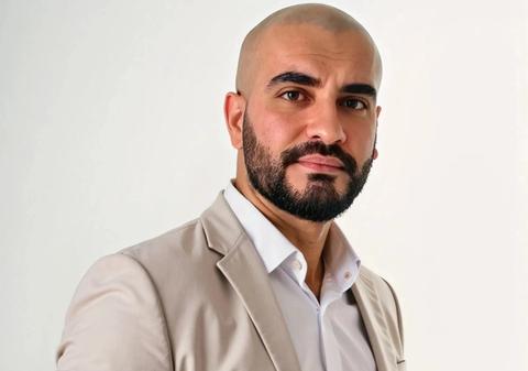 Headshot of Di Sandhu, General Manager