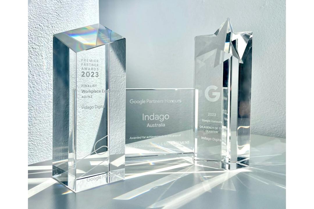 Three Google Premier Partner award trophies. 