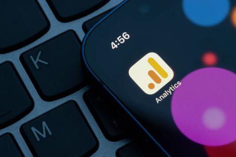 Close up iPhone on keyboard displaying the Google Analytics 4 (GA4) app