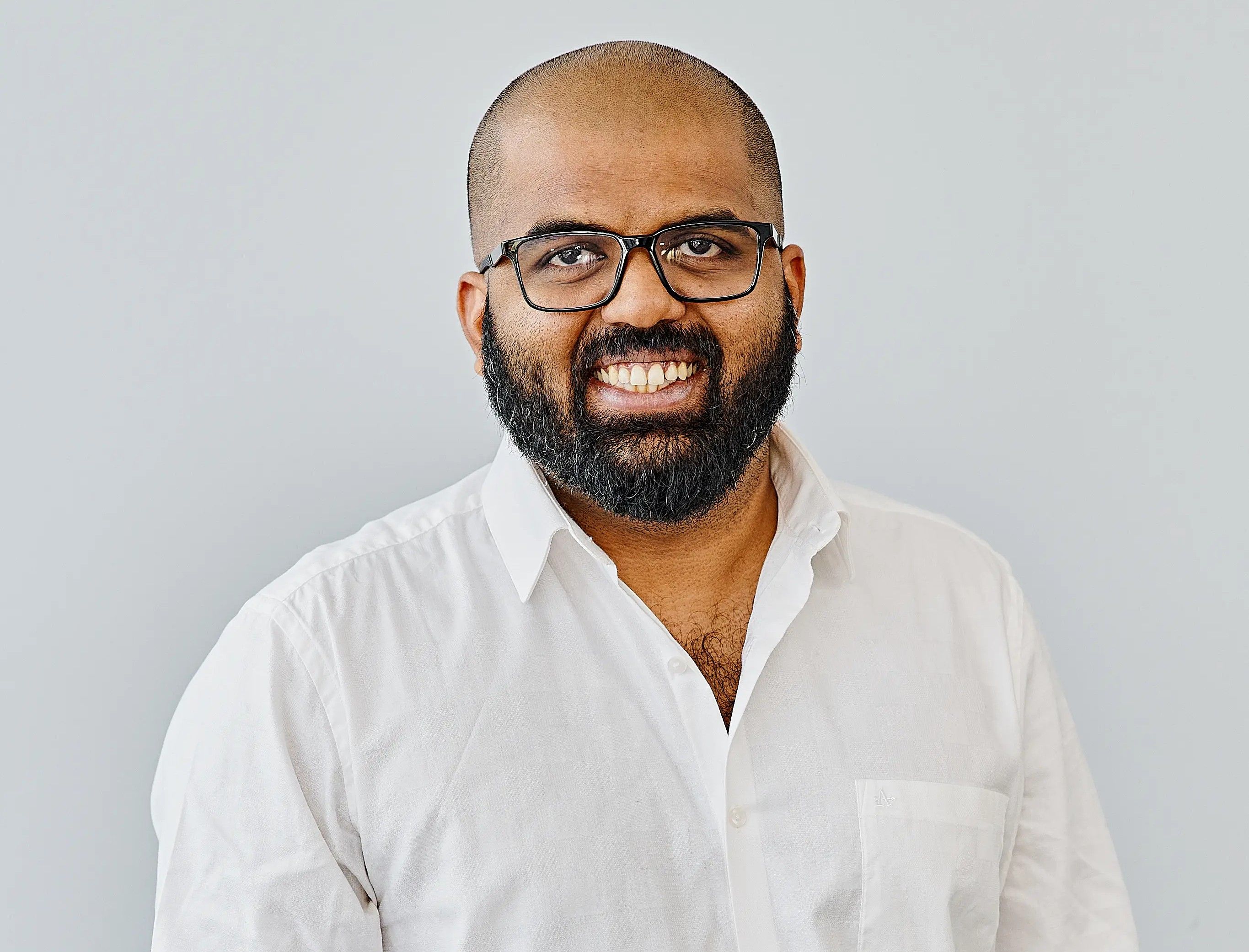 Headshot of Nitin Karunakaran, SEO Implementations Director