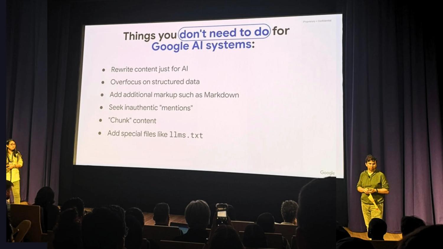 Photo of stage, speaker and screen at Google's Search Central Live event in Sydney.
