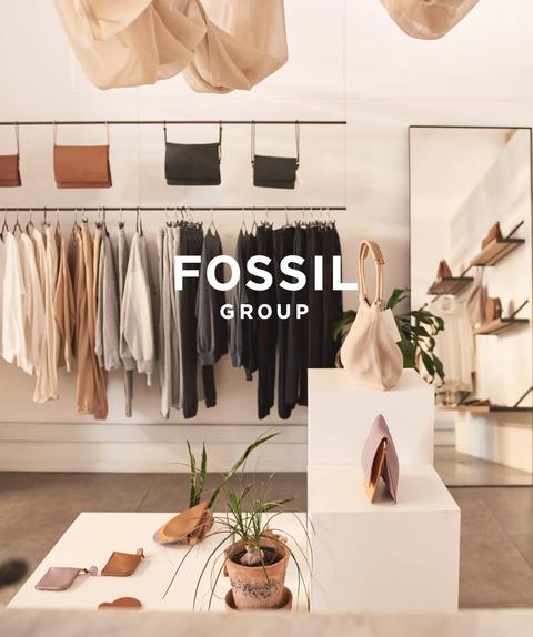 Fossil Group logo over store interior.