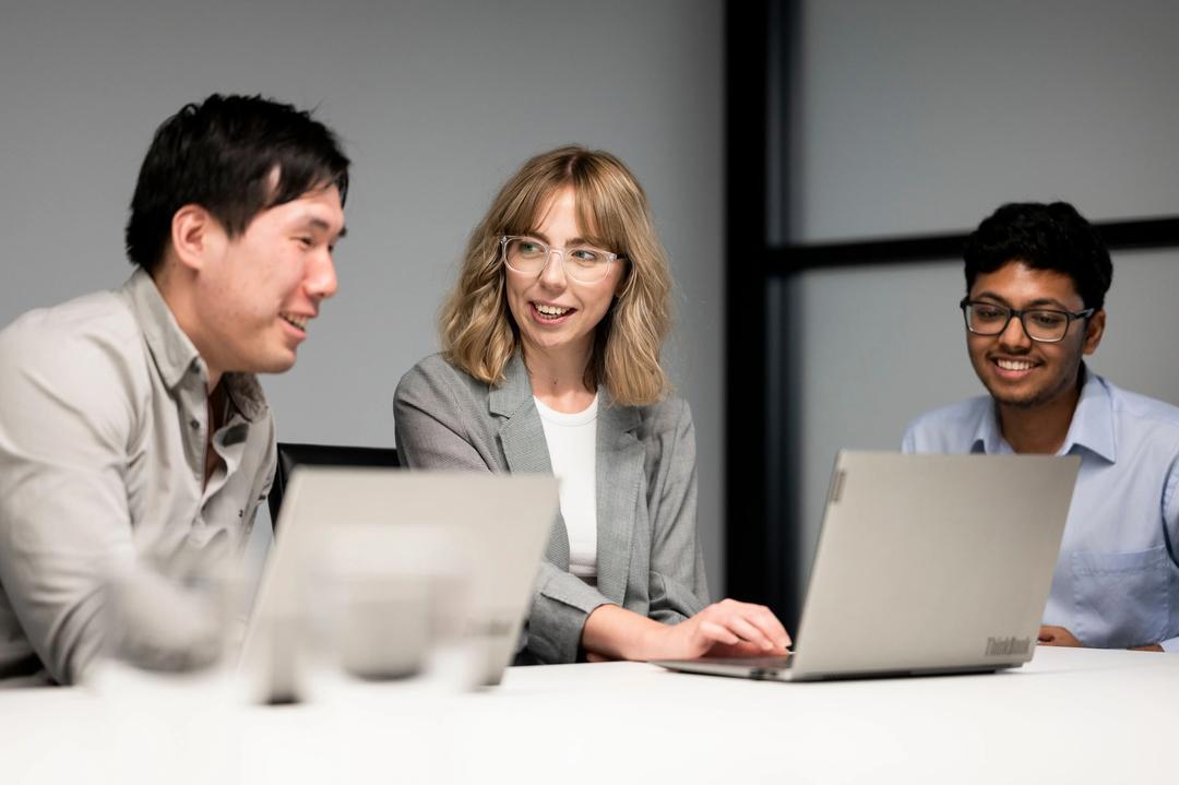 Male and female SEO experts working together on website migration project.