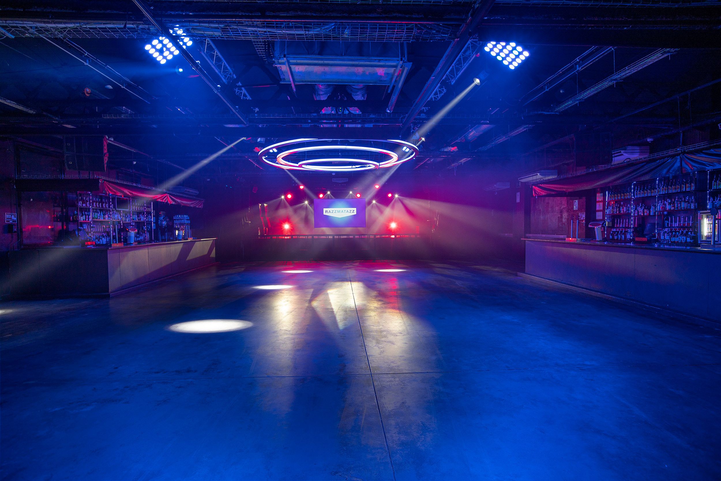 Razzmatazz Barcelona exterior at night with neon signage and queue of partygoers