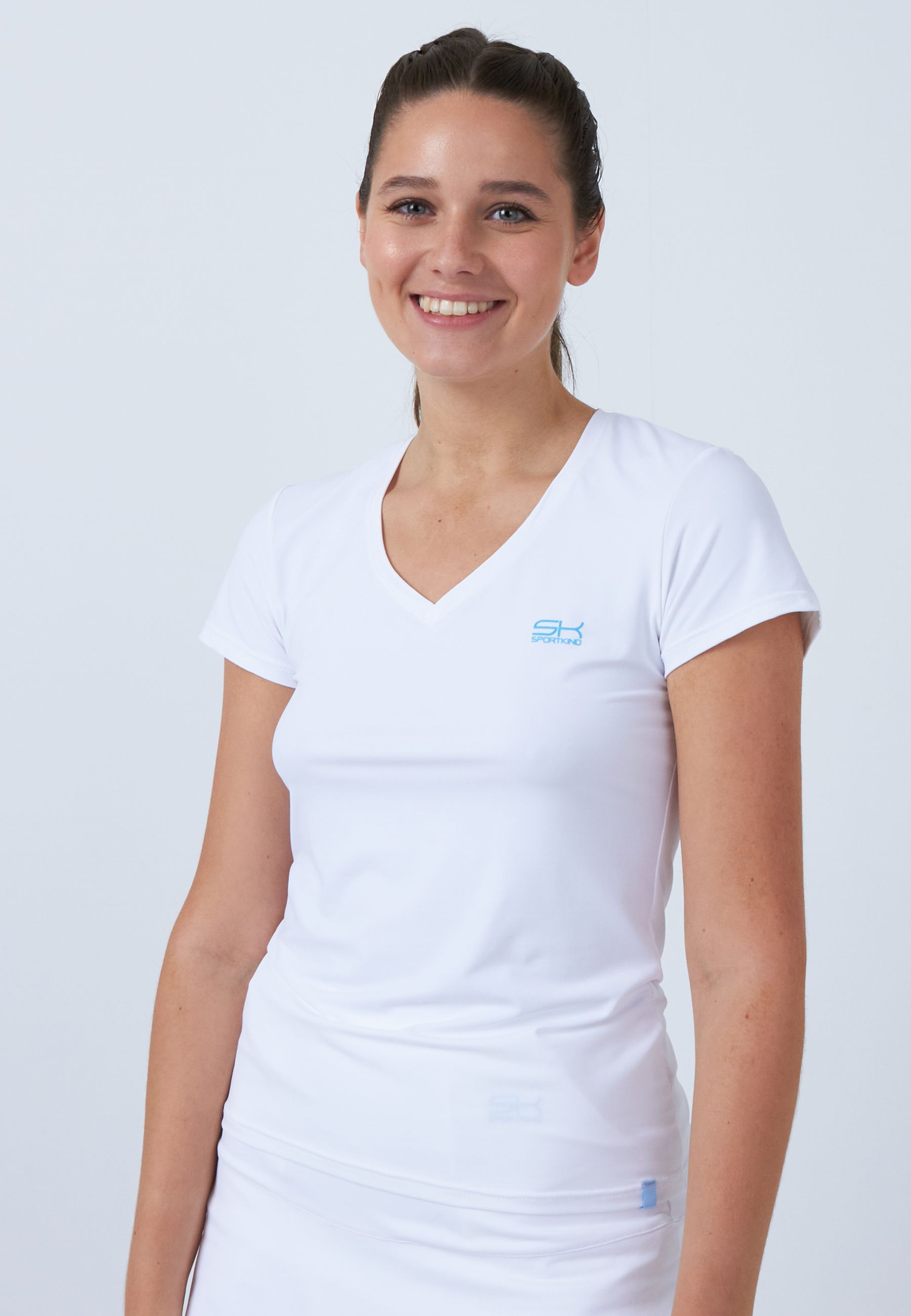 Fille en t-shirt de tennis col en V de SPORTKIND