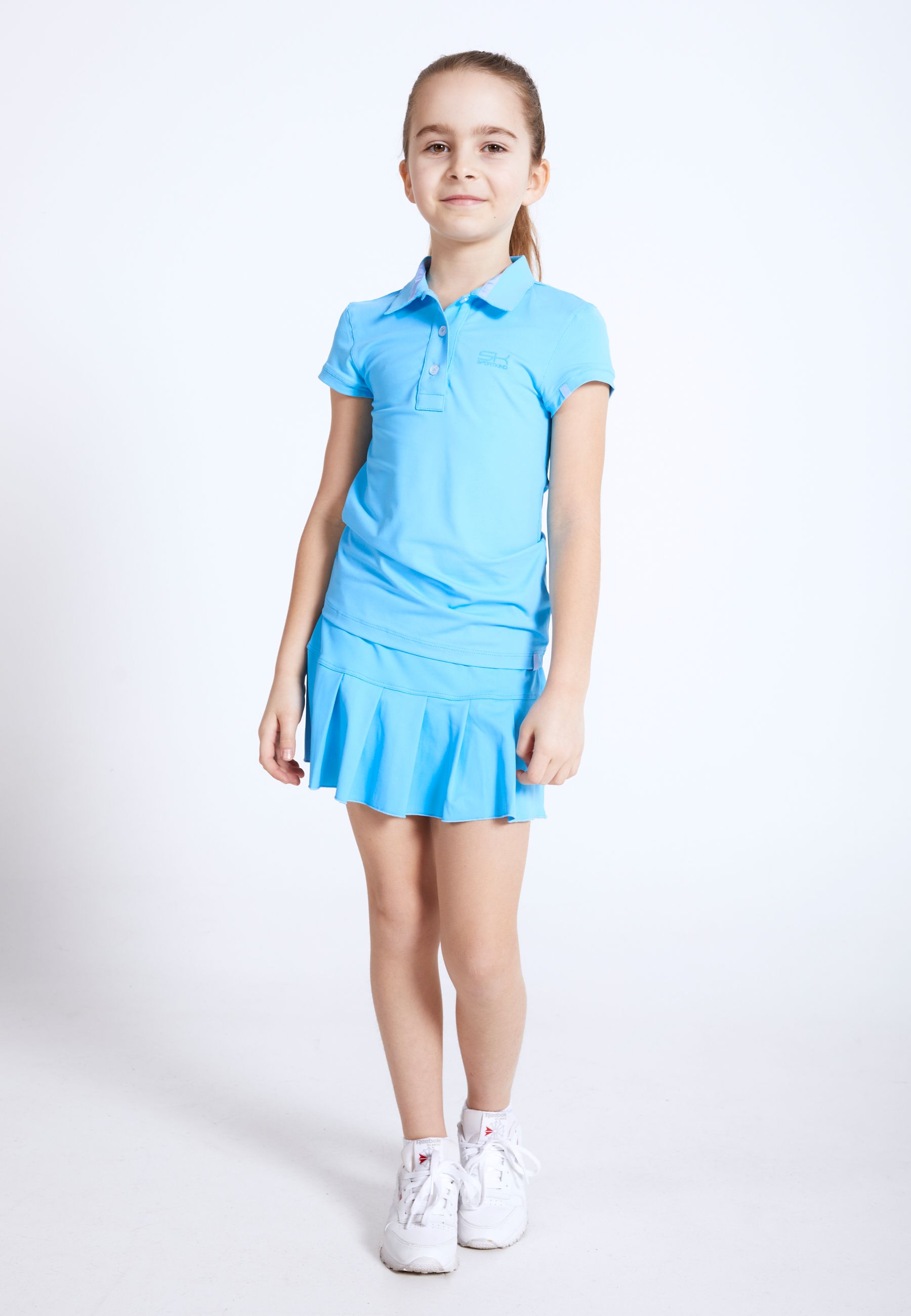 Fille en polo de tennis de SPORTKIND