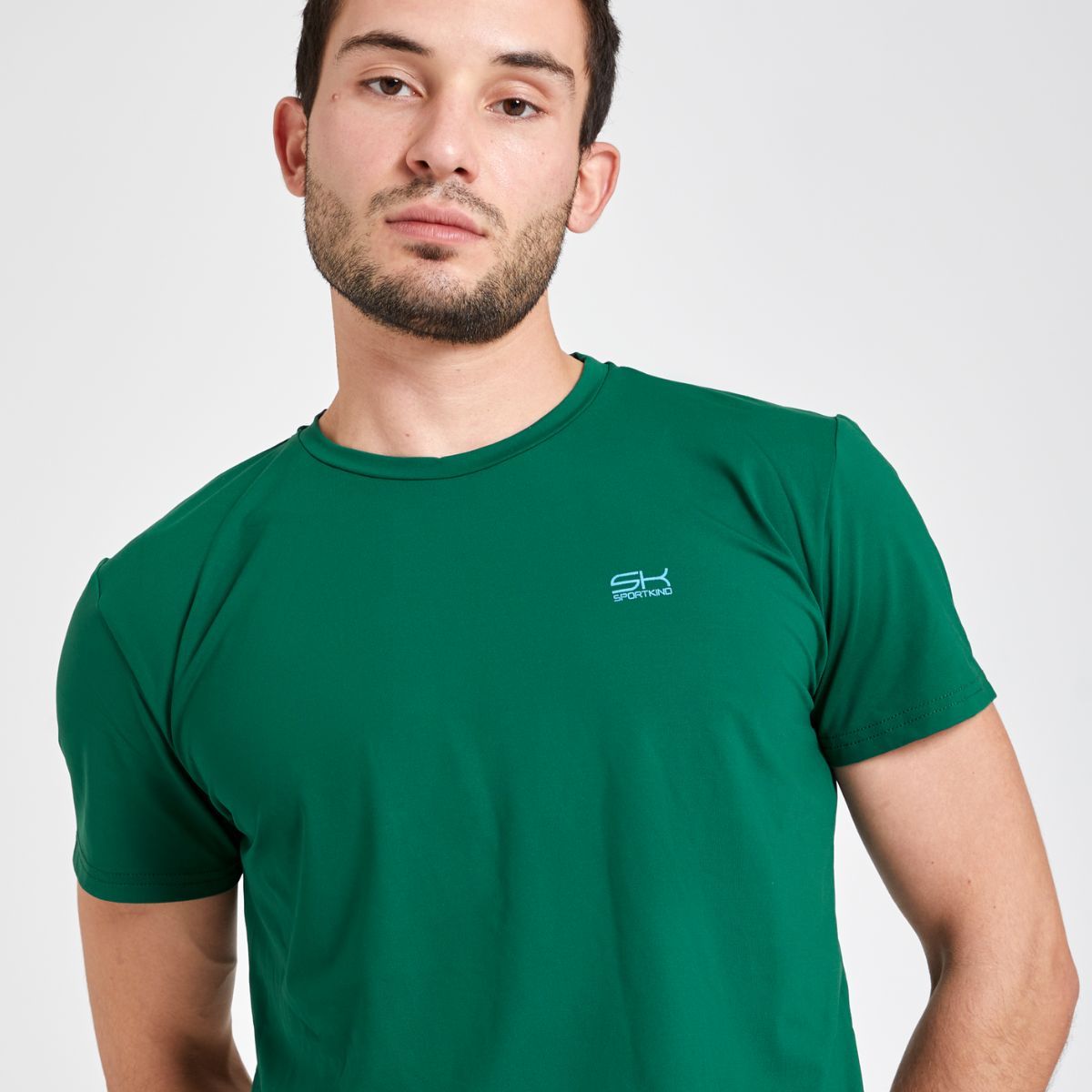Man dressed in fir green tenniswear