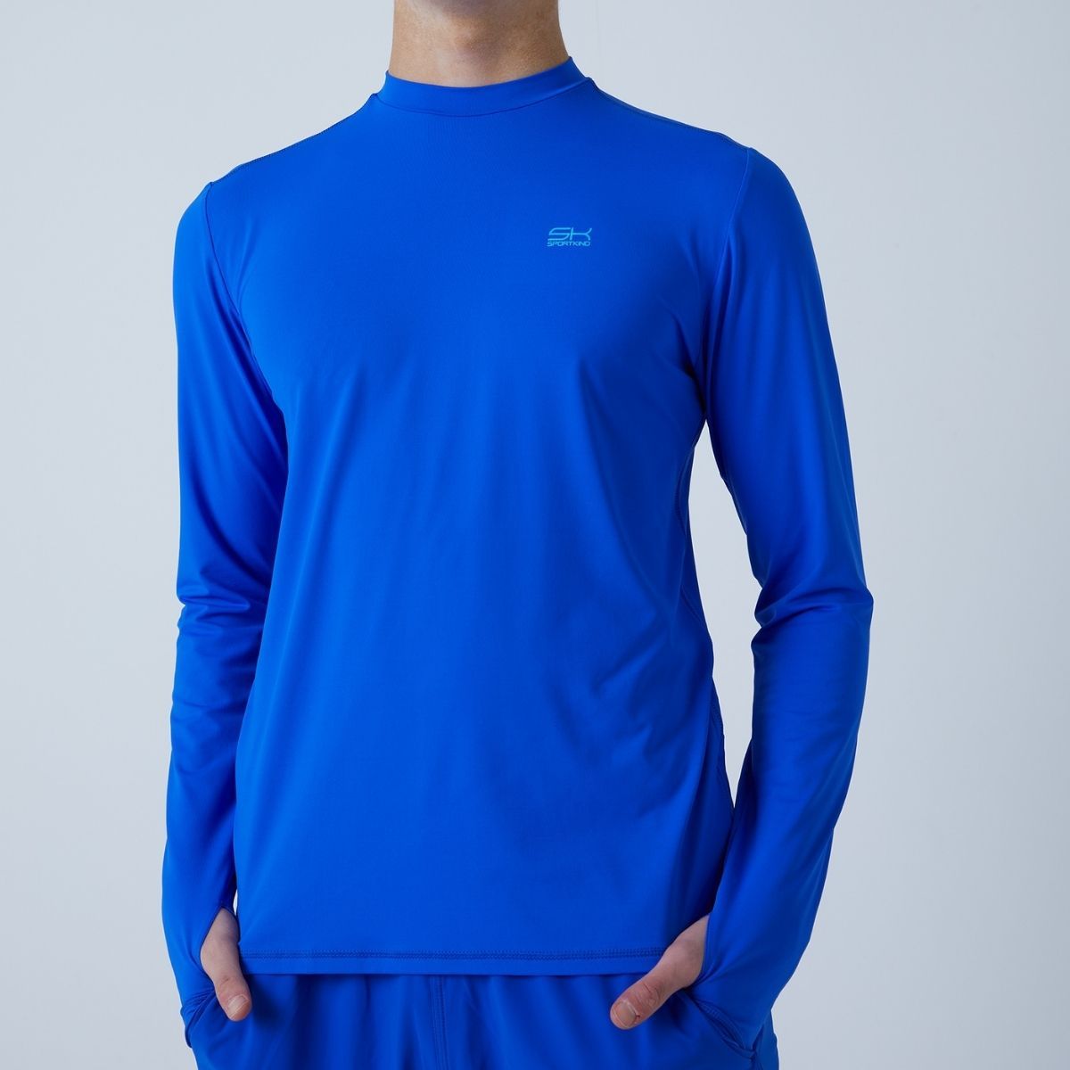 Man in a blue high-neck longsleeve shirt by Sportkind