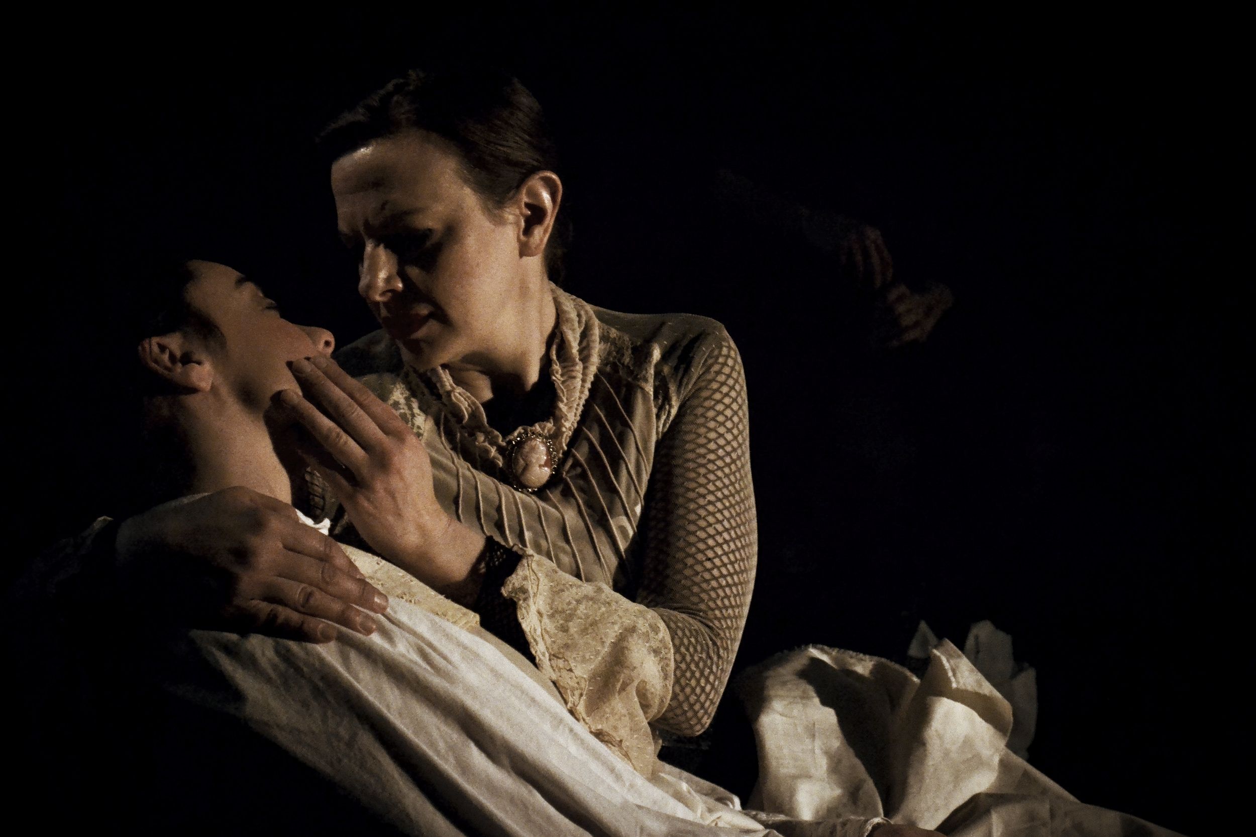 Jane cradles and kisses her dying girlfriend