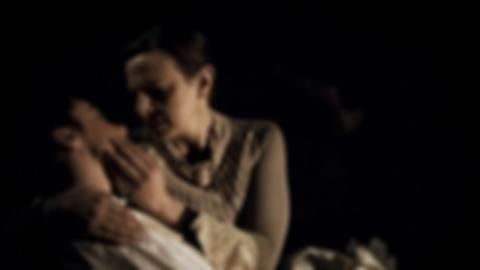 Jane cradles and kisses her dying girlfriend