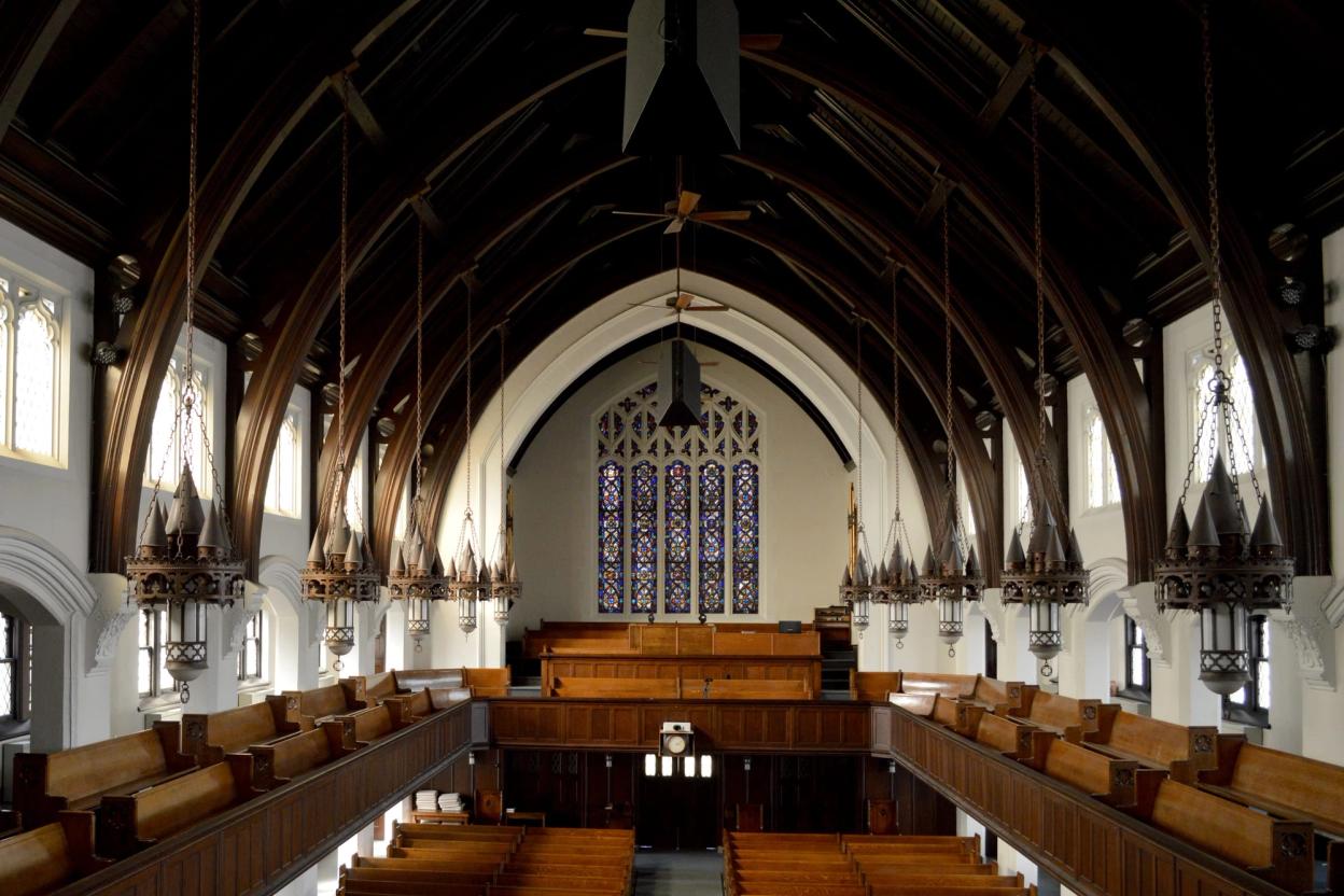 The sanctuary down the center aisle, the vaulted timber ceiling overhead