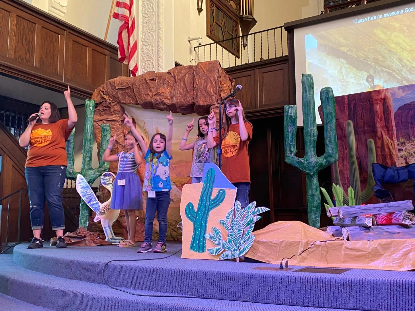 Children singing on stage at Vacation Bible School