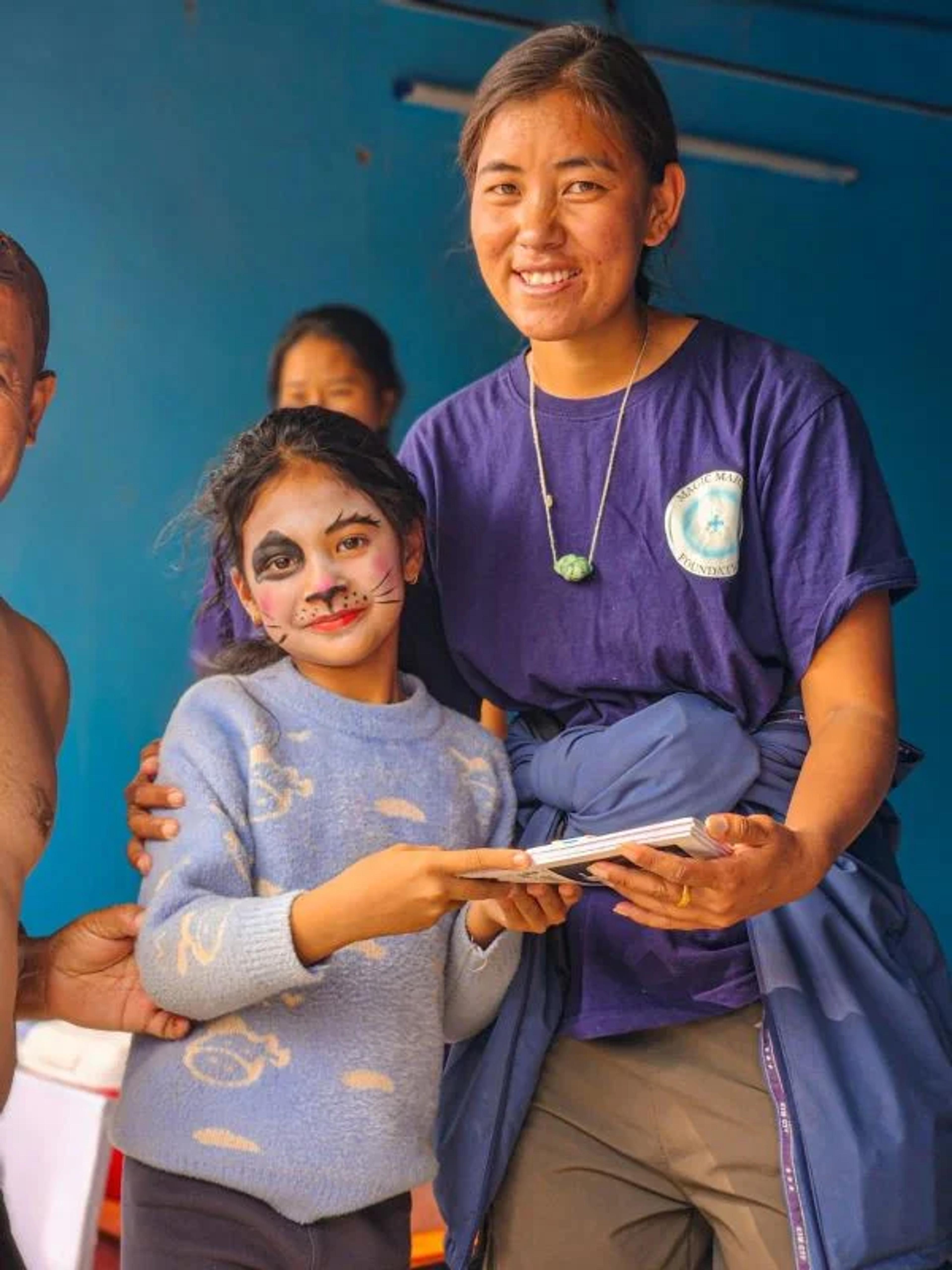  Kilamu with students at C.A.R.E. humane education event 