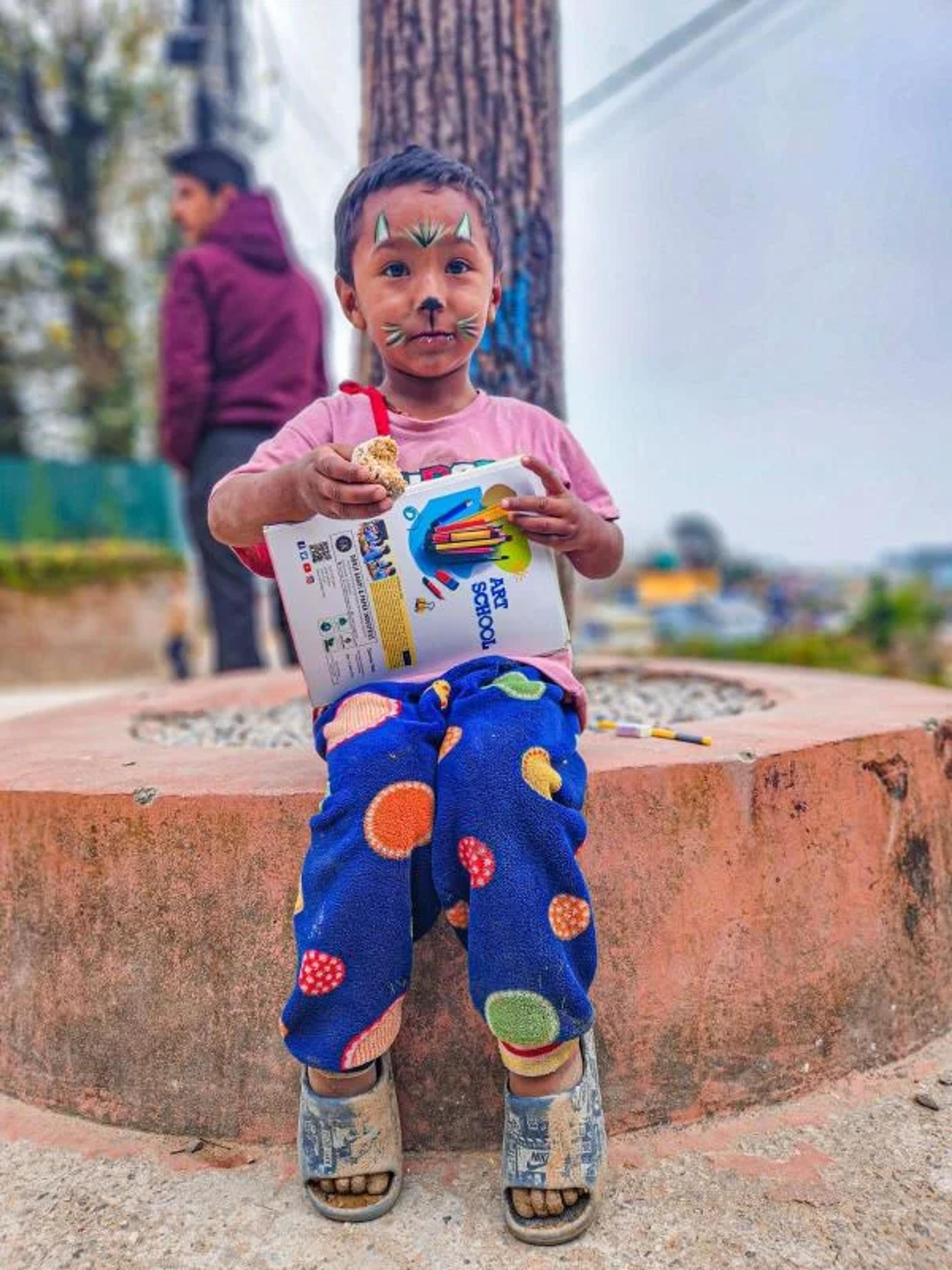 Children enjoy vegan treats, humane education books and school supplies at C.A.R.E. Class, Nepal 