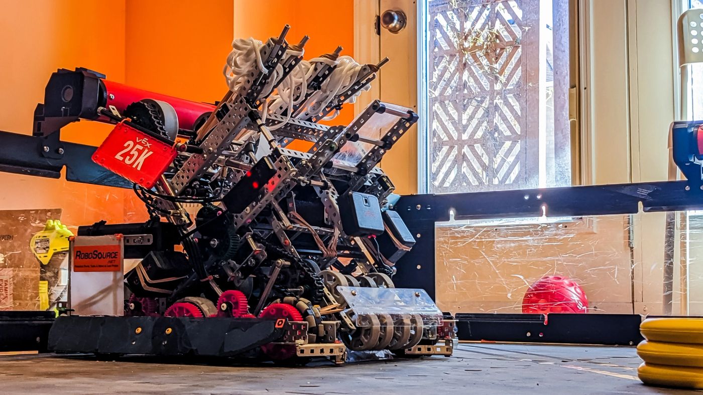 Competitive robotics robot with its disc launcher extended