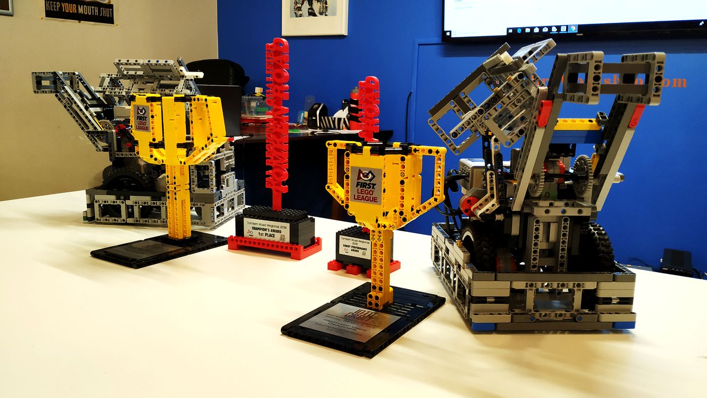 Team Polaris robot displayed with robotics competition trophies