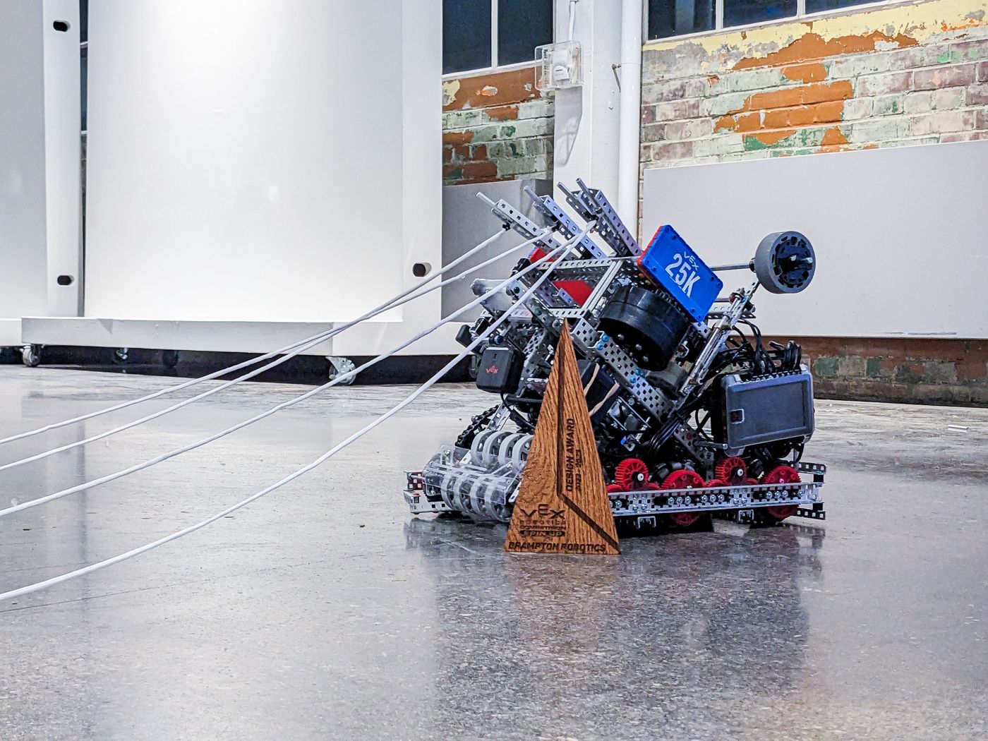Team 25K robot with extended string mechanisms and an award