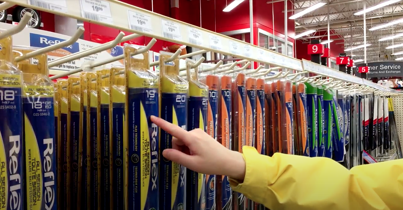Person selecting wipers in store