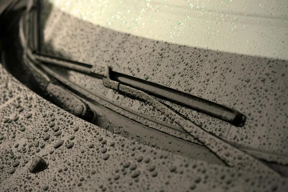 Aero streamlined Wiper Blades resting on a Wet Windscreen