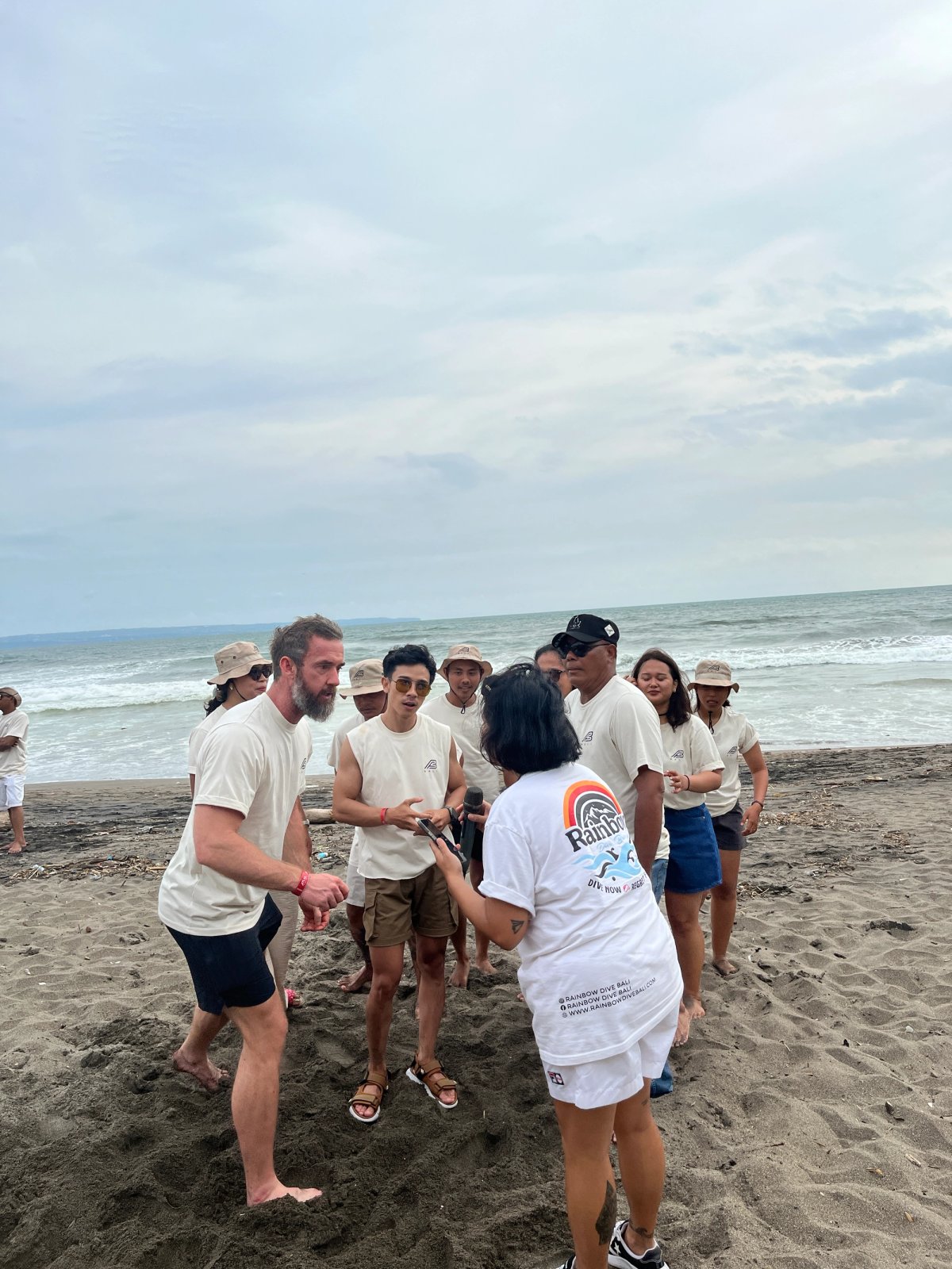 Body Factory Bali team joining a beach team-building activity during their corporate outing