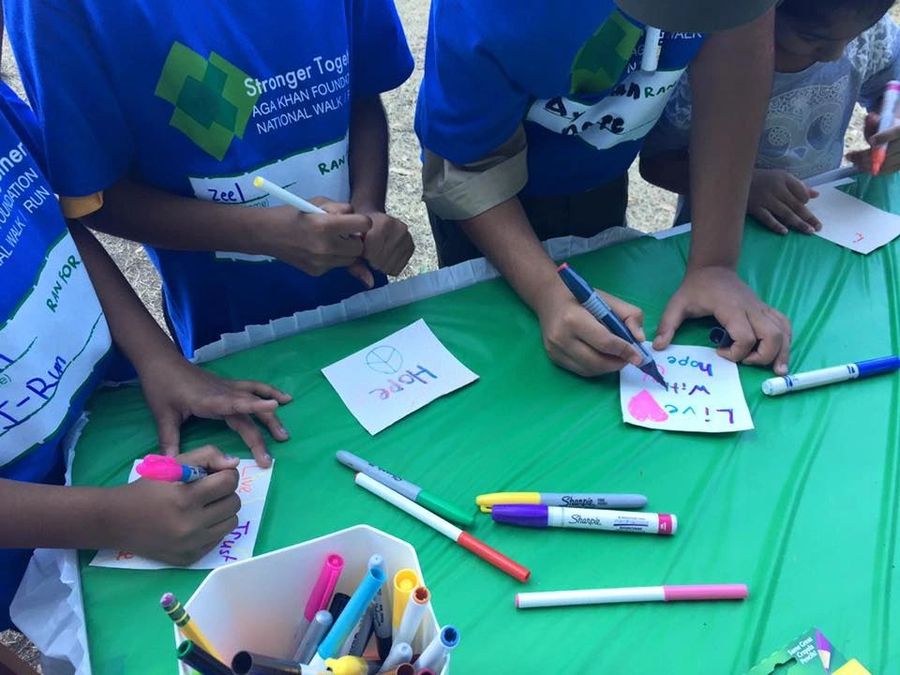 Houston children writing messages of hope
