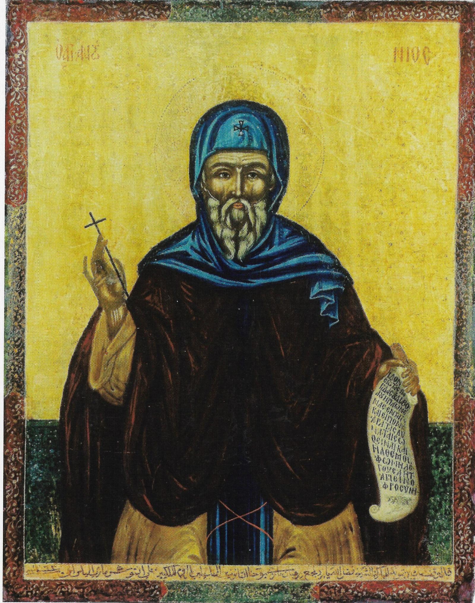 Ícone de Santo Antão, o Grande, com a cruz numa mão e o rolo de seus ditos na outra.