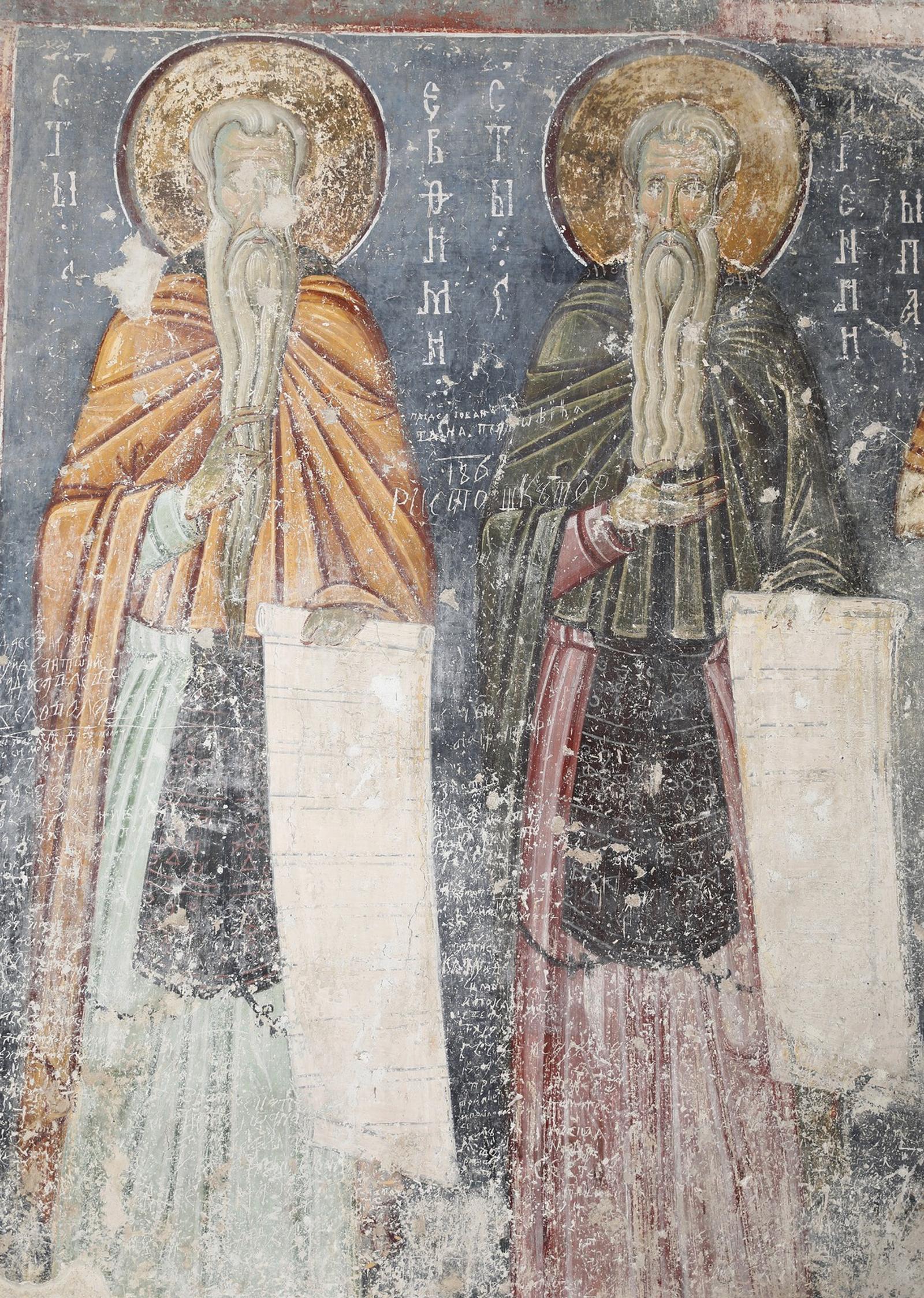 Afresco medieval de Santo Eutímio e Santo Arsênio, com longas barbas de eremitas e rolos nas mãos.