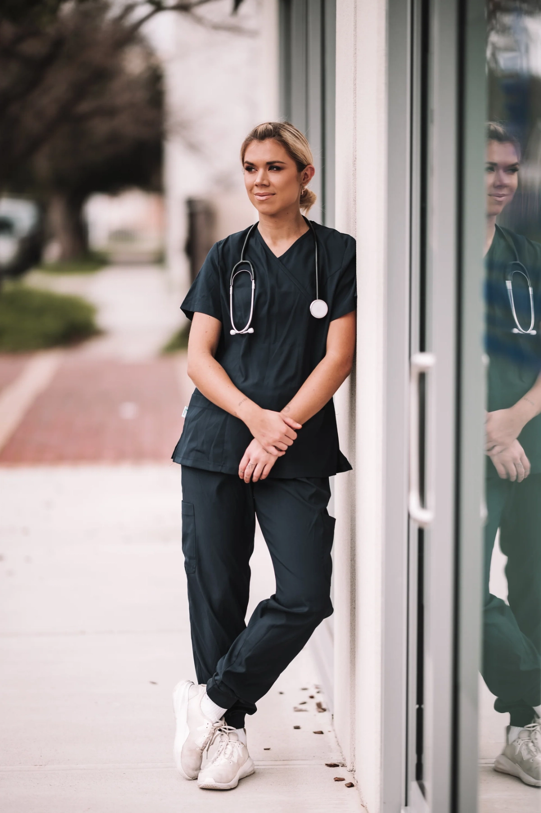 nurse standing against wall