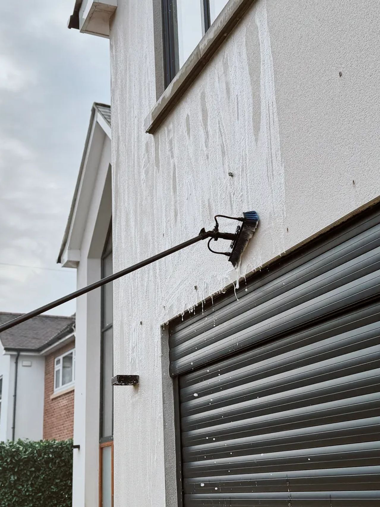 A Willow Alexander team soft washing render on a house, 3