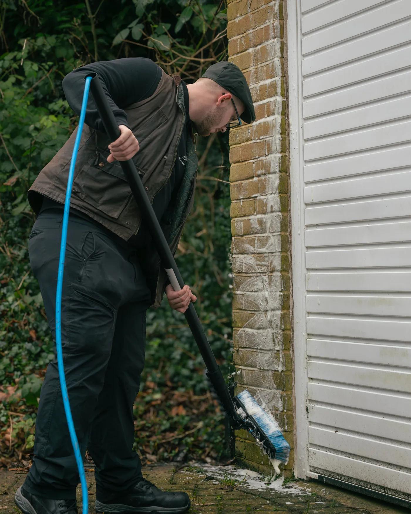 A Willow Alexander team soft washing render on a house, 1