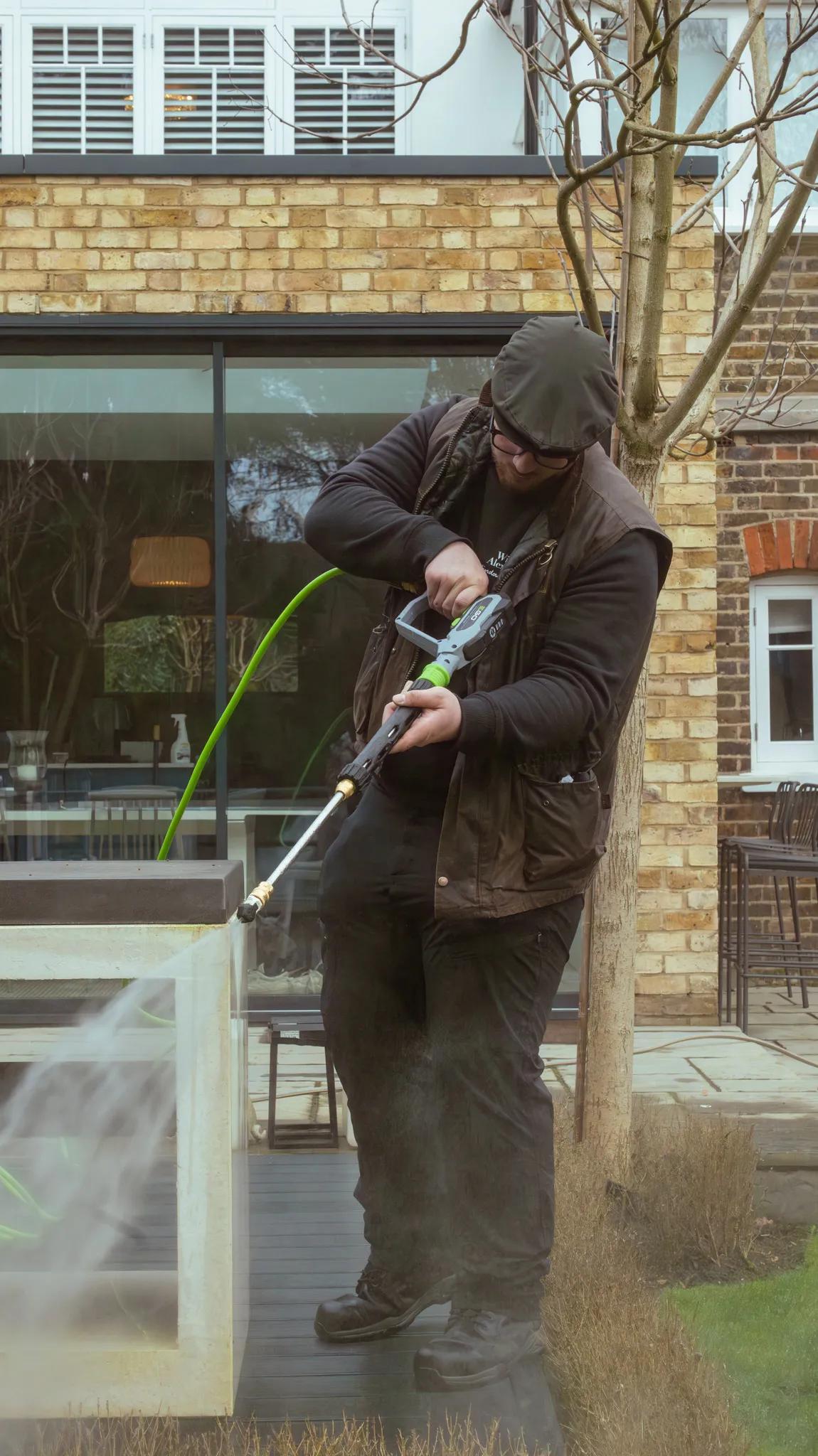 A Willow Alexander team jet washing a driveway, 3