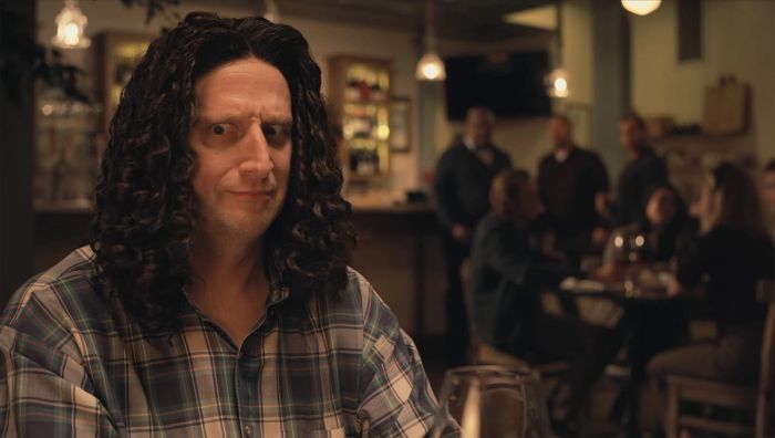 That guy right there with the plaid shirt and the hair that hangs over his sides like they're dog ears.