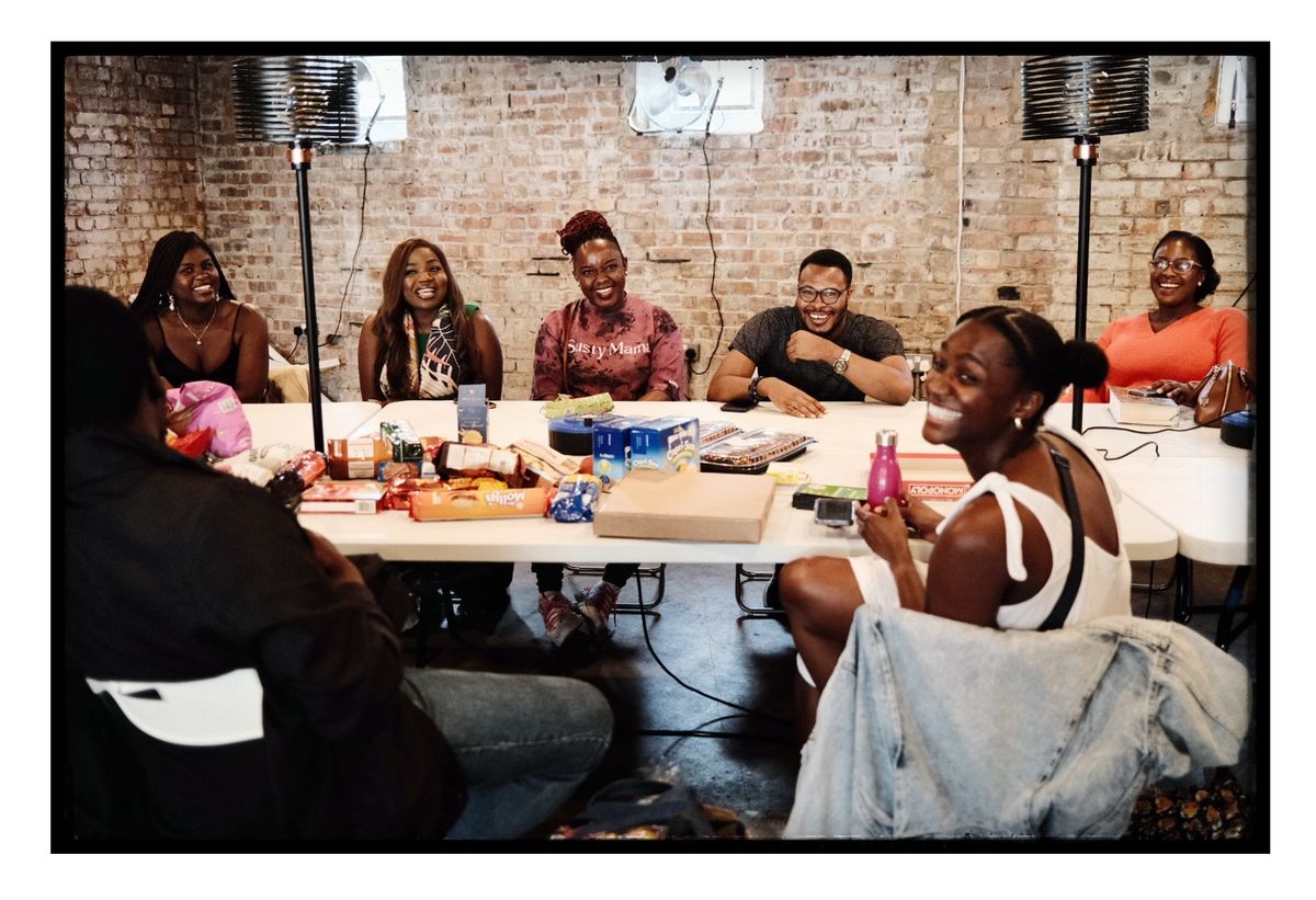 SustyVibes Meet & Greet, London — table-laugh