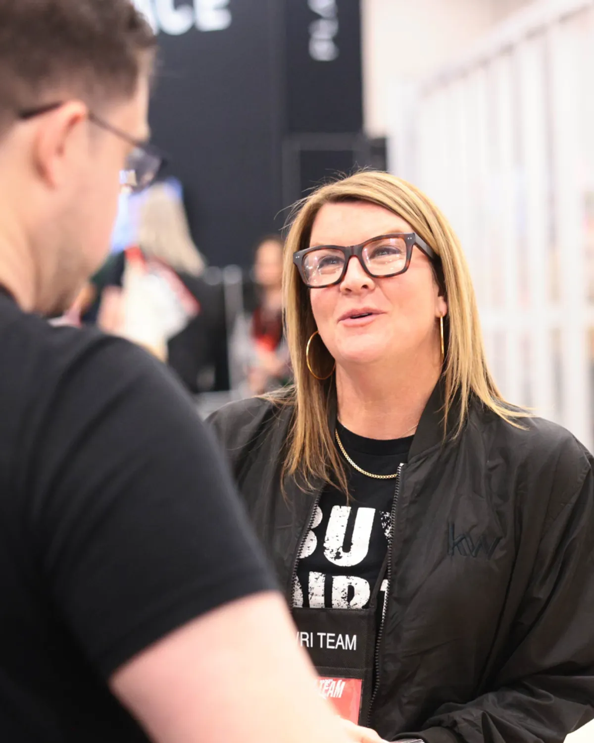 KW Staff smiling and talking