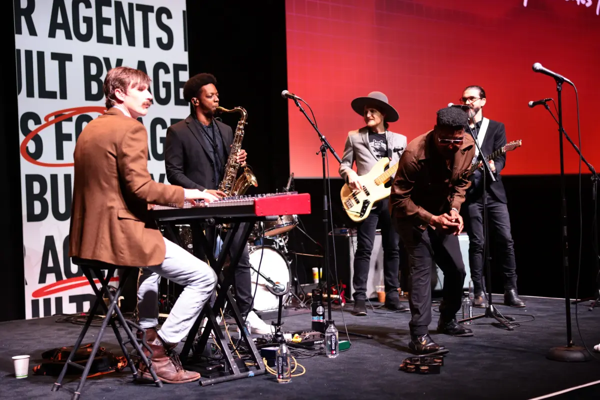 Band playing on stage at Mega Agent Camp