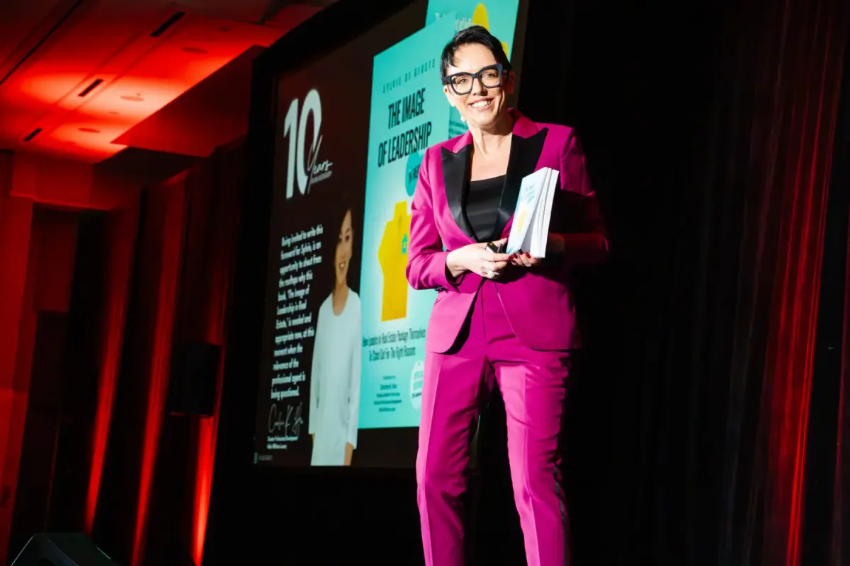 Keynote speaker smiling on stage