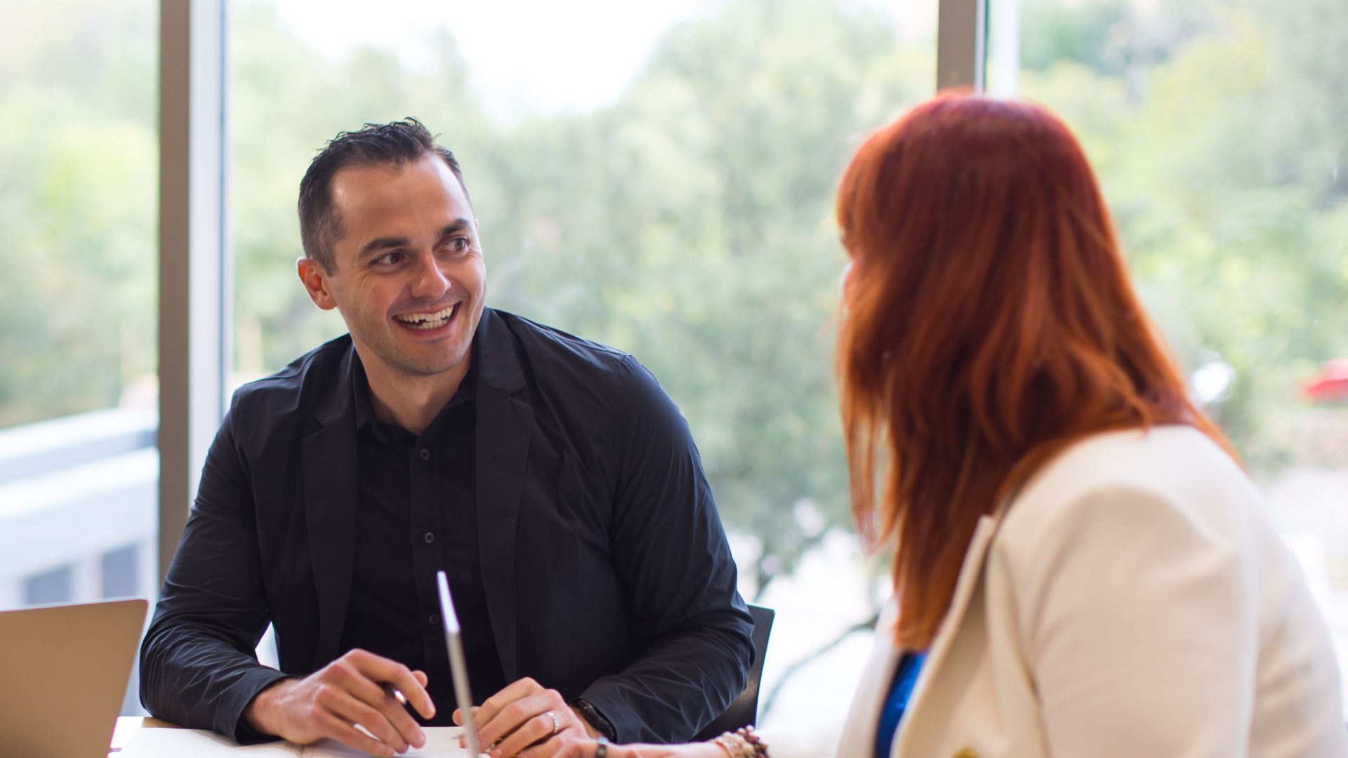 Experienced real estate agent reviewing business strategy