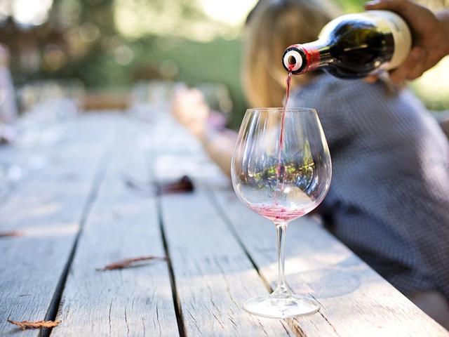 Pouring a glass of red wine