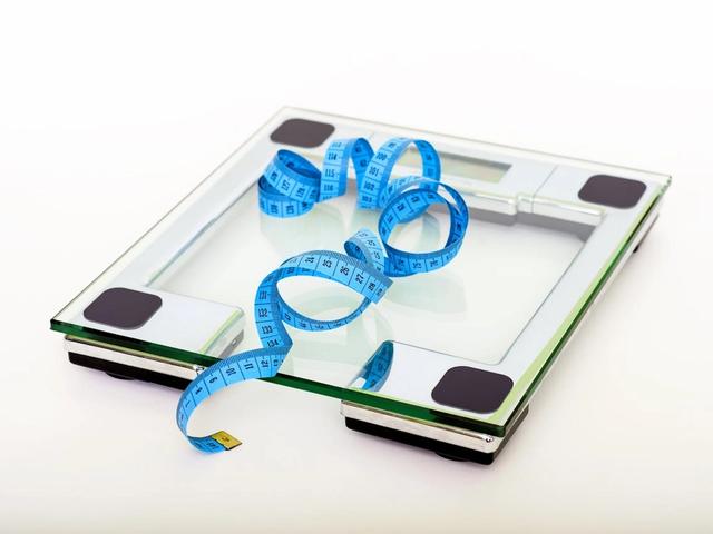 Scale with tape measure on top