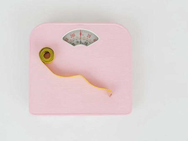 Measuring tape on a weight scale