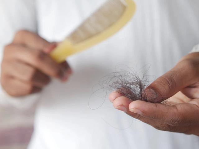 Person holding hair