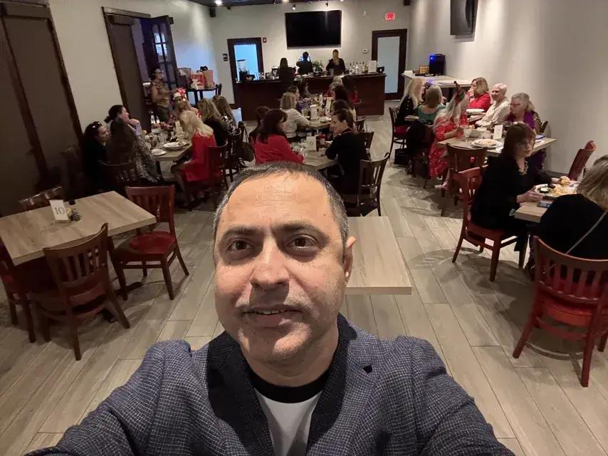 A packed room at a holiday dinner