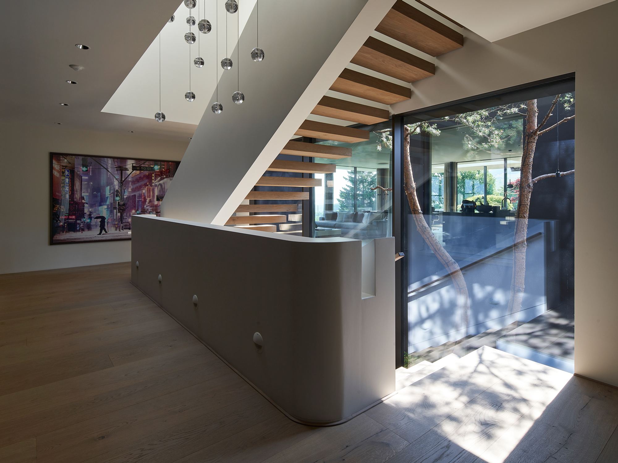 Staircase with timber treads, skylight and cascade of lights – Single-family house in Schindellegi