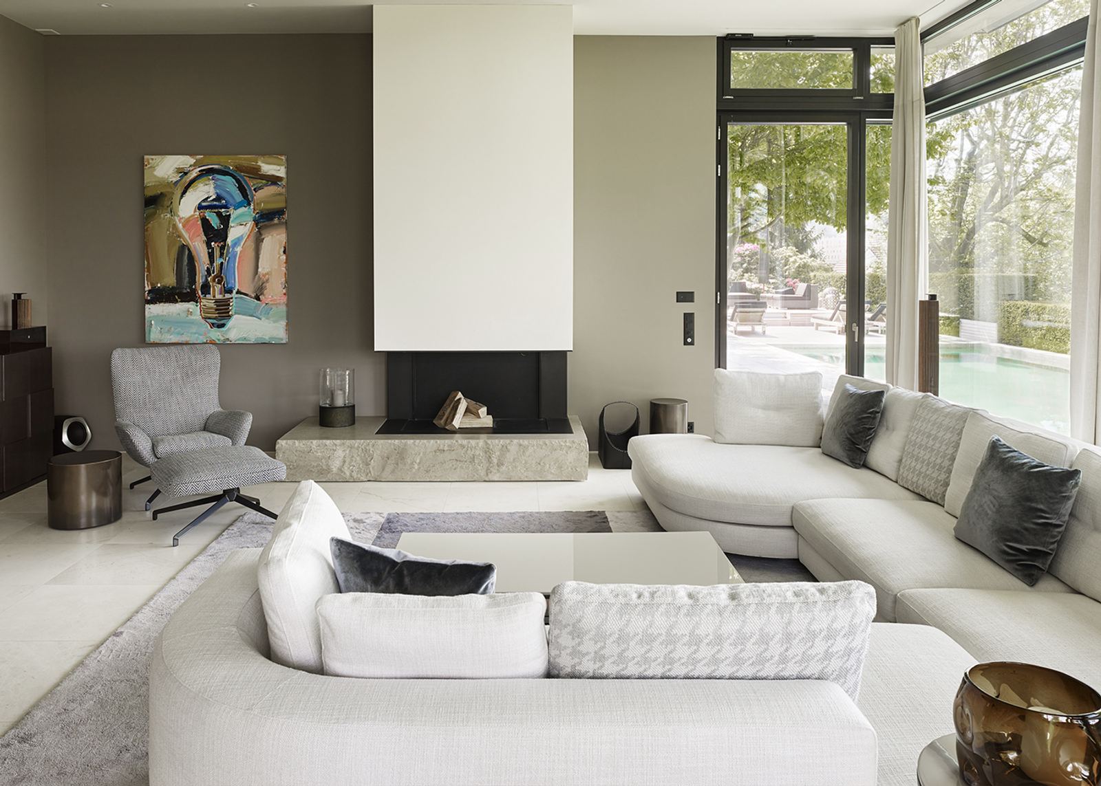 Living room with white corner sofa and fireplace
