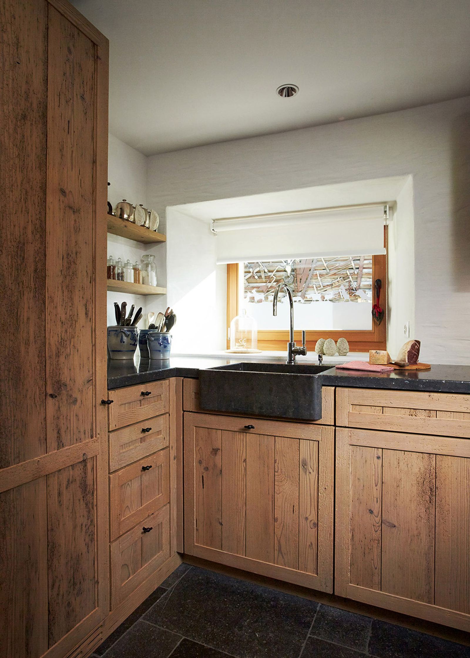 Reclaimed timber kitchen with stone sink