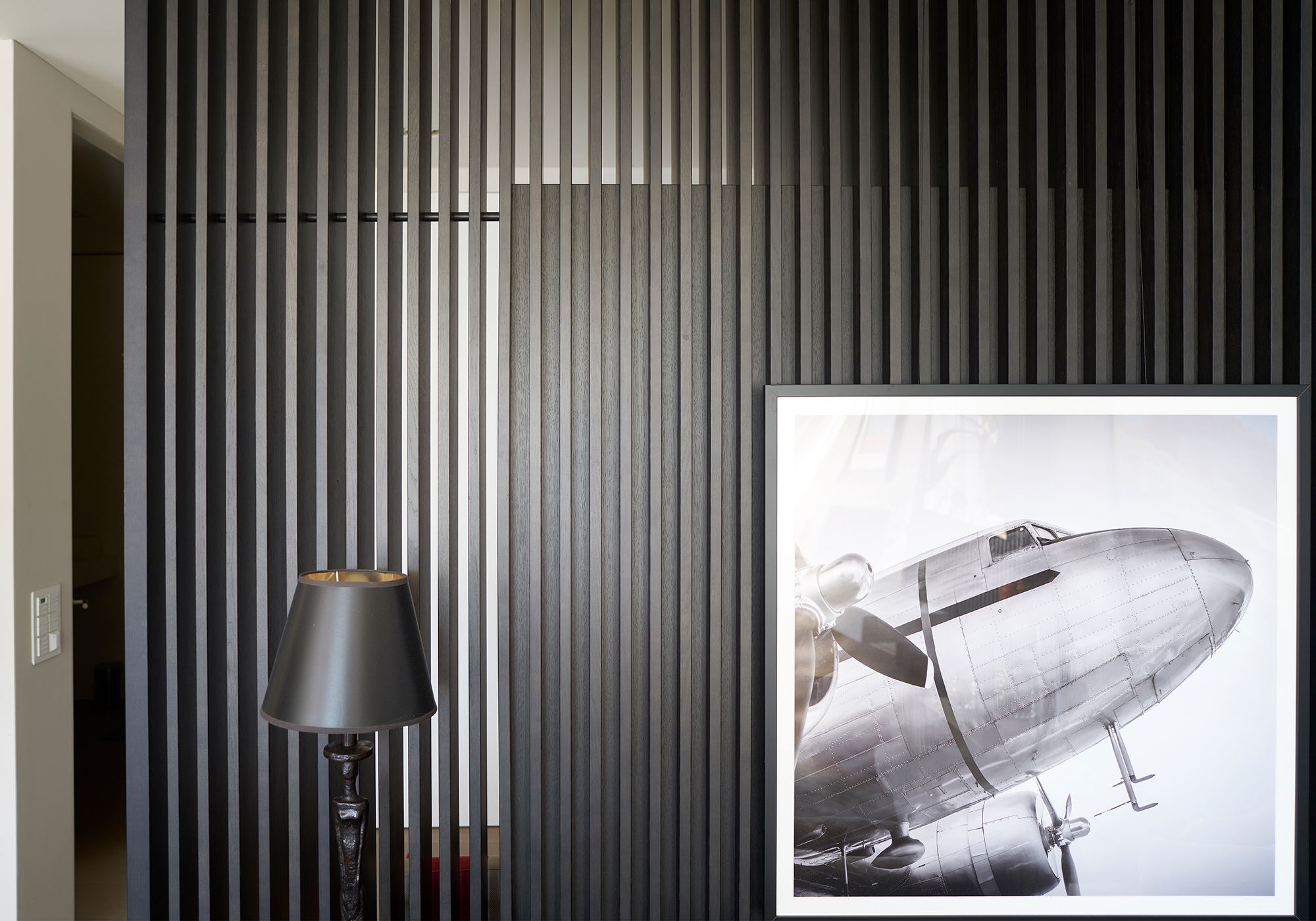 Dark timber slats with framed photograph – Interiors and landscape, Luzern