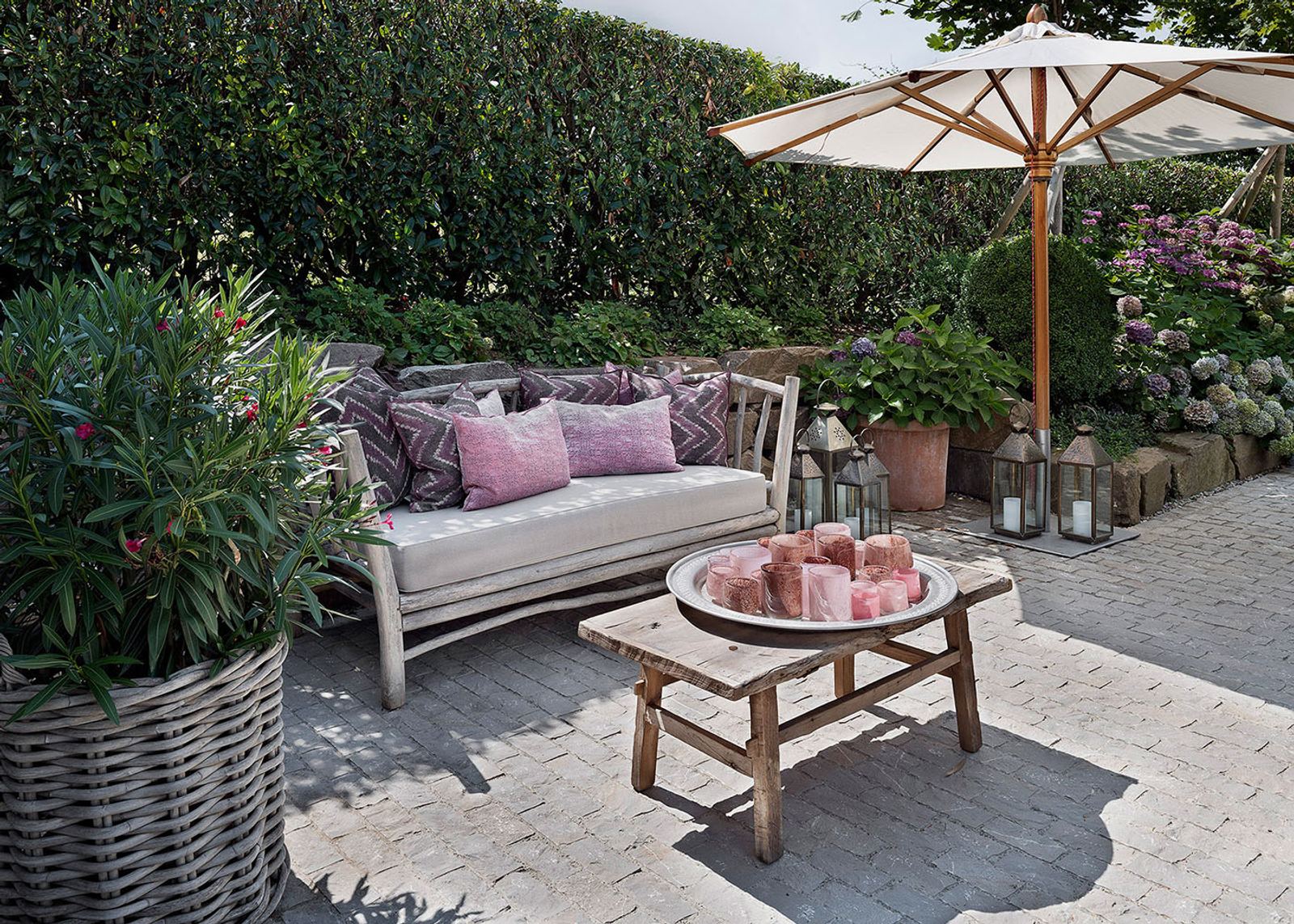 Seating area with timber sofa and parasol