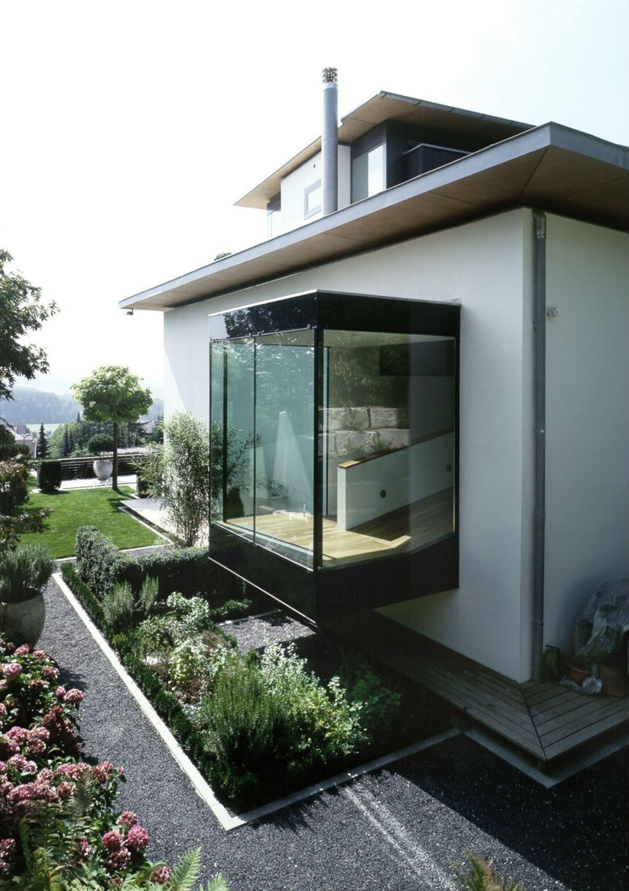 Glass extension with planting – Single-family house in Uitikon